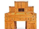 an image of a wooden desk with drawers and a desk top