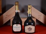 two bottles of wine sitting next to each other on a table