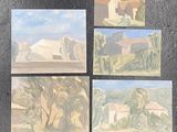 several paintings of different landscapes are displayed on a black surface
