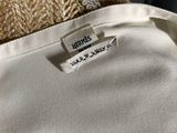 a close up of a white shirt with a label on it