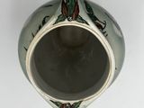 a vase that has a design on the inside of it