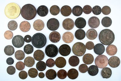 a lot of coins that are on the table
