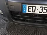 a close up of the front of a car with a license plate