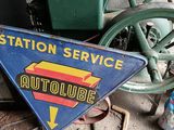 a sign that says station service on the side of a building