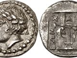 a silver coin with an image of a man on it