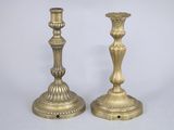 pair of antique brass candlesticks on a white background