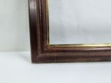 a close up of a wooden frame with a white background