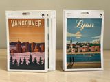 two cards with a picture of a city on them