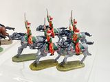 four figurines of men riding on horses on display