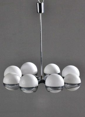 an image of a chandelier with six eggs hanging from it