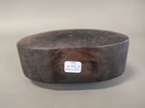 a wooden bowl with a sticker on it