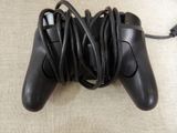 a video game controller that is connected to a charger