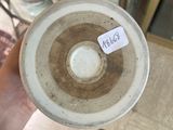a person holding a cup with a sticker on it