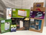 several boxes of philips appliances are sitting on a white surface