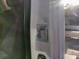 a close up of a door handle with a sticker on it