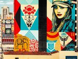 a large mural of a woman on the side of a building