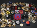 a lot of badges and other items on a table