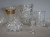 a lot of glass items that are sitting on a table