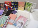 many different types of notebooks sitting on a table