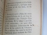 an open book with a picture of a bird on it