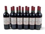 six bottles of red wine are lined up in a row