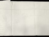 un gros plan d'une feuille de papier sur laquelle figure un dessin
