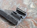 a small metal object on a marble surface