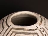 a close up of a vase on a black background