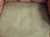 an image of a chair that has a cushion on it