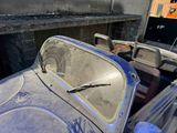 an old car that has been left in the garage