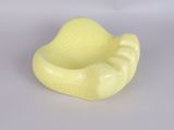 a small yellow bowl that is sitting on a table