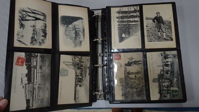 a person holding a binder with a bunch of pictures on it