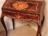 a small table with a drawer on top of it