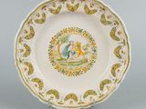 a plate with a picture of a man and a dog on it