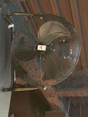 a fan that is attached to the side of a building