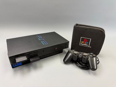 Console Sony PS1 avec deux manettes et un étui de transport