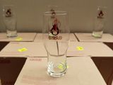 a box of beer glasses sitting on a table