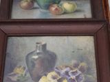 two paintings of flowers and a vase on a shelf