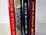 three books that are sitting on top of each other