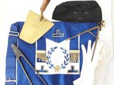 a blue apron with white gloves, a shovel, and a pair of white gloves