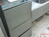 a stainless steel dishwasher and a sink in a kitchen