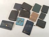 a lot of wallets that are sitting on a table