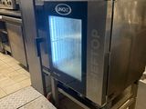 several ovens are stacked on top of each other in a kitchen