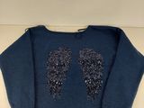 a blue sweater with sequins on the shoulders