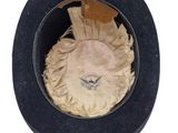 a black hat with a feather on top of it