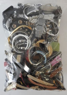 a bag of assorted watches and other items in it