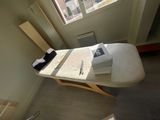 a table with a bunch of papers on it in a room