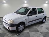 a picture of a small white car parked in a garage