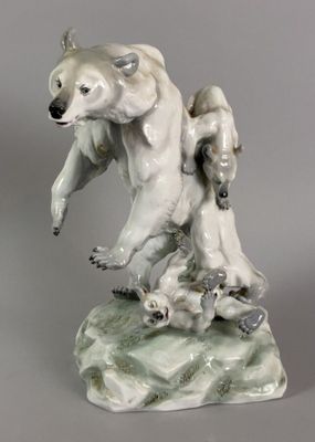 a statue of a polar bear with two cubs