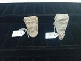 three pieces of art that are sitting on a black surface
